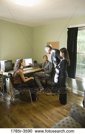 Stock Image - Women entrepreneurs in a business meeting. Fotosearch
