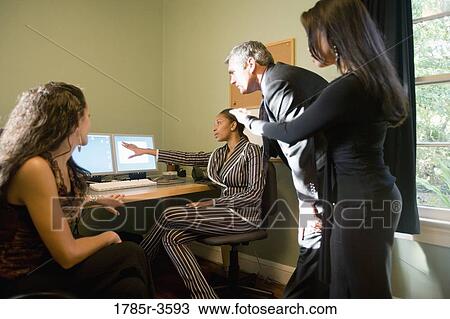 Stock Image - Women entrepreneurs in a business meeting. Fotosearch
