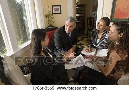 Women entrepreneurs in a business meeting View Large Photo Image Stock Photo - Women entrepreneurs in a business meeting. Fotosearch
