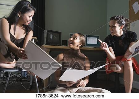 Women entrepreneurs working in office View Large Photo Image Picture - Women entrepreneurs working in office. Fotosearch
