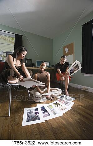 Stock Image - Women entrepreneurs working in office. Fotosearch