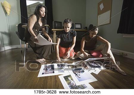 Stock Photo - Women entrepreneurs working in office. Fotosearch