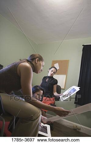 Women entrepreneurs working in office View Large Photo Image Stock Photo - Women entrepreneurs working in office. Fotosearch