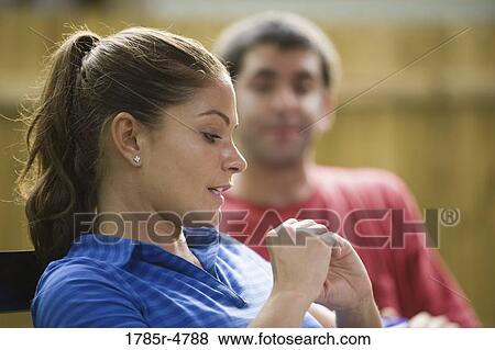 Stock Photo - Young couple sitting together. Fotosearch