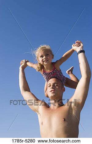 Young father and daughter playing View Large Photo Image Stock Image - Young father and daughter playing. Fotosearch