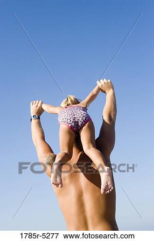 Young father and daughter playing View Large Photo Image Stock Photo - Young father and daughter playing. Fotosearch