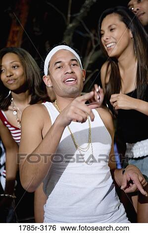 Stock Photograph - Young men and women in hip-hop fashion dancing. Fotosearch