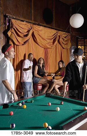 Young men in hip-hop fashion shooting billiards View Large Photo Image Stock Photo - Young men in hip-hop fashion shooting billiards. Fotosearch