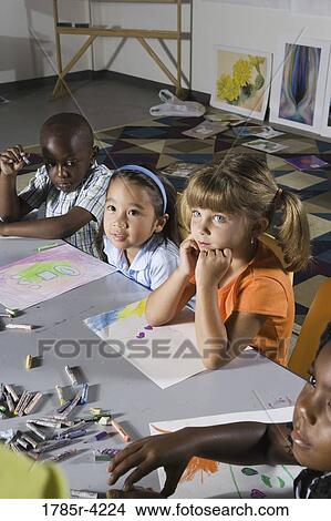 Young students sitting in art class View Large Photo Image Picture - Young students sitting in art class. Fotosearch