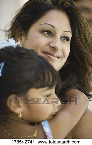Stock Image - Young woman with young girl. Fotosearch