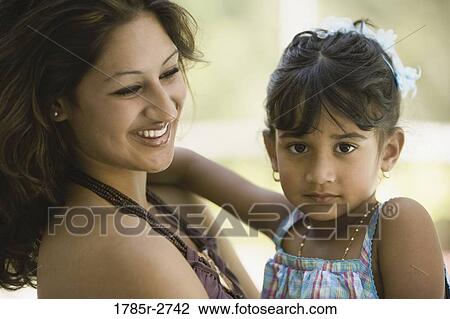 Young woman with young girl View Large Photo Image Stock Image - Young woman with young girl. Fotosearch