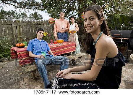 A Mexican-American family enjoying a backyard picnic View Large Photo Image Stock Photo - A Mexican-American family enjoying a backyard picnic. Fotosearch