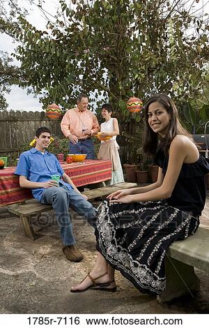 A Mexican-American family enjoying a backyard picnic View Large Photo Image Stock Photograph - A Mexican-American family enjoying a backyard picnic. Fotosearch