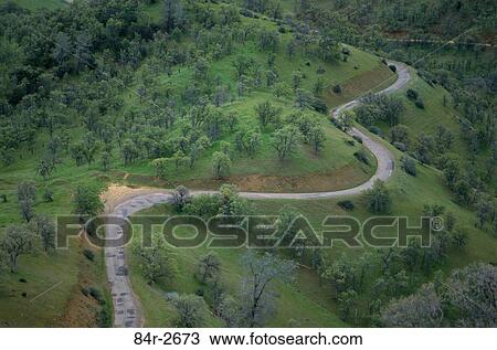 Aerial view of a winding road on a hill, California, USA View Large Photo Image Stock Image - Aerial view of a winding road on a hill, California, USA. Fotosearch