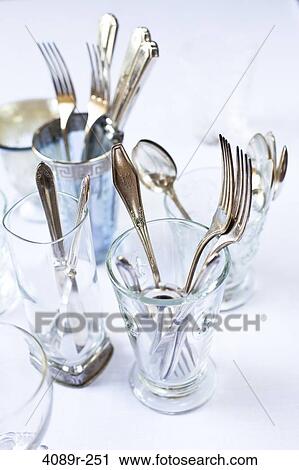 Antique silverware and glasses on a dining table View Large Photo Image Stock Image - Antique silverware and glasses on a dining table. Fotosearch