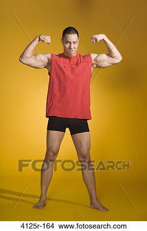 Picture - Athlete flexing muscles. Fotosearch