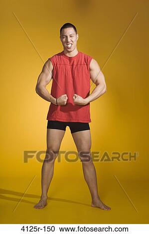 Stock Image - Athlete flexing muscles. Fotosearch