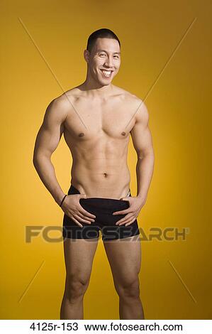 Stock Image - Athlete smiling while posing. Fotosearch