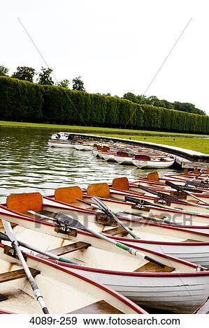 Boats moored in a canal, Grand Canal, Chateau De Versailles, Versailles, Paris, Ile-De-France, France View Large Photo Image Stock Photo - Boats moored in a canal, Grand Canal, Chateau De Versailles, Versailles, Paris, Ile-De-France, France. Fotosearch