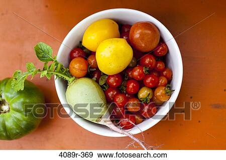 Bowl of fresh picked fruit and vegetables, studio shot View Large Photo Image Stock Photo - Bowl of fresh picked fruit and vegetables, studio shot. Fotosearch