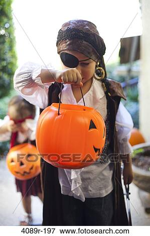 Boy and girl playing Trick Or Treat View Large Photo Image Stock Photo - Boy and girl playing Trick Or Treat. Fotosearch