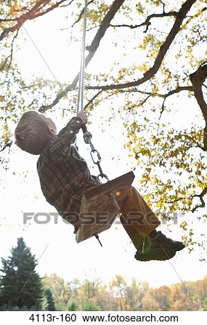 Boy on swing View Large Photo Image Stock Image - Boy on swing. Fotosearch
