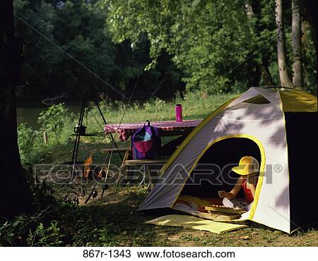 Boy sitting in a tent View Large Photo Image Stock Image - Boy sitting in a tent. Fotosearch