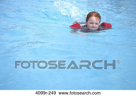 Boy swimming in outdoor pool View Large Photo Image Stock Photo - Boy swimming in outdoor pool. Fotosearch