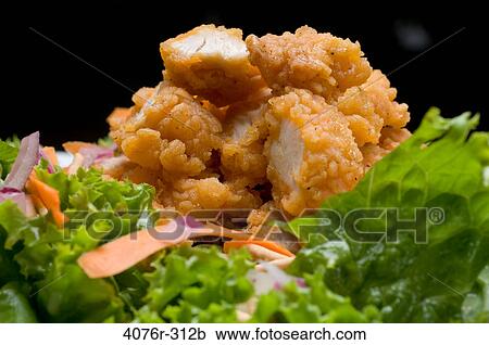 Breaded chicken with onion and carrot on lettuce leaves View Large Photo Image Stock Image - Breaded chicken with onion and carrot on lettuce leaves. Fotosearch