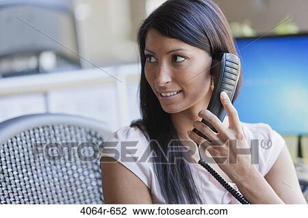 Businesswoman answering phone View Large Photo Image Stock Image - Businesswoman answering phone. Fotosearch
