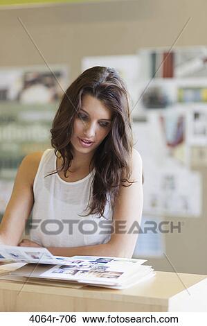 Stock Photograph - Businesswoman in office. Fotosearch