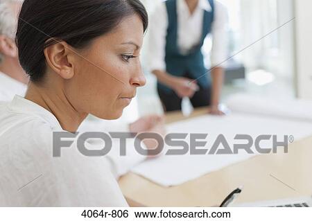 Stock Photograph - Businesswoman in office. Fotosearch