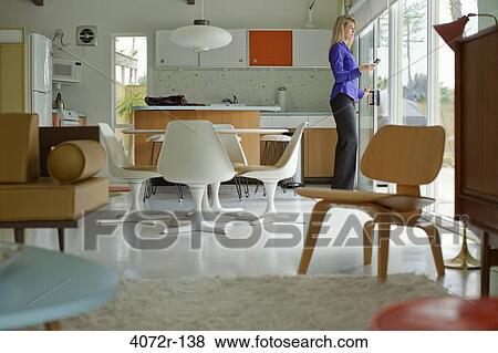Businesswoman text messaging at home View Large Photo Image Stock Photo - Businesswoman text messaging at home. Fotosearch