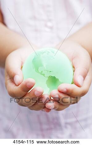 Child holding green glass globe View Large Photo Image Stock Photography - Child holding green glass globe. Fotosearch
