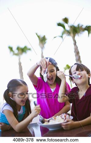 Children eating ice cream sundae View Large Photo Image Stock Photo - Children eating ice cream sundae. Fotosearch