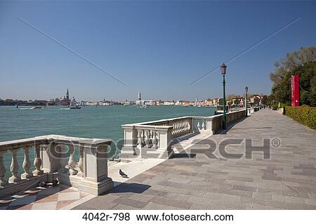 City at the waterfront viewed from a public garden, Venice, Veneto, Italy View Large Photo Image Stock Photo - City at the waterfront viewed from a public garden, Venice, Veneto, Italy. Fotosearch