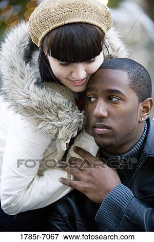 Close-up of a contemplative young inter-racial couple View Large Photo Image Stock Photo - Close-up of a contemplative young inter-racial couple. Fotosearch