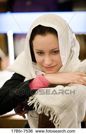 Close-up of a contemplative young woman wearing a head scarf View Large Photo Image Stock Photograph - Close-up of a contemplative young woman wearing a head scarf. Fotosearch