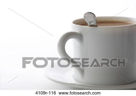 Close-up of a cup of coffee with a saucer and stirrer spoon View Large Photo Image Stock Photograph - Close-up of a cup of coffee with a saucer and stirrer spoon. Fotosearch