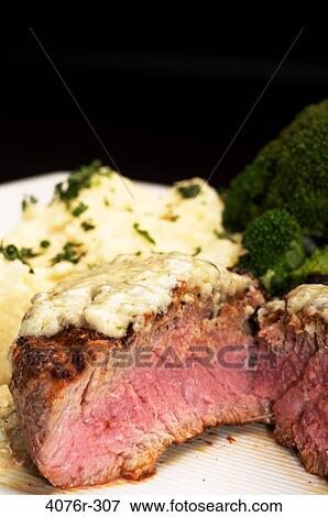 Close-up of a grilled steak with mashed potatoes and broccoli View Large Photo Image Stock Photo - Close-up of a grilled steak with mashed potatoes and broccoli. Fotosearch