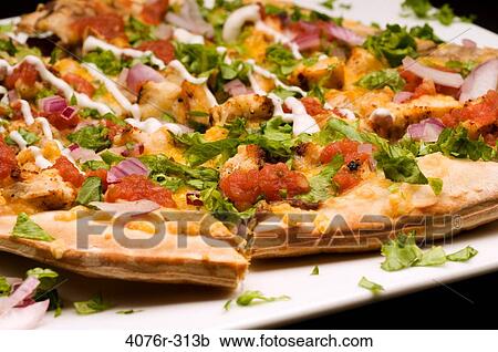 Close-up of a Mexican pizza with toppings of vegetables View Large Photo Image Stock Image - Close-up of a Mexican pizza with toppings of vegetables. Fotosearch