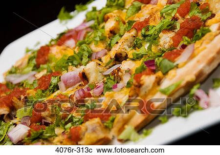 Close-up of a Mexican pizza with toppings of vegetables View Large Photo Image Stock Image - Close-up of a Mexican pizza with toppings of vegetables. Fotosearch