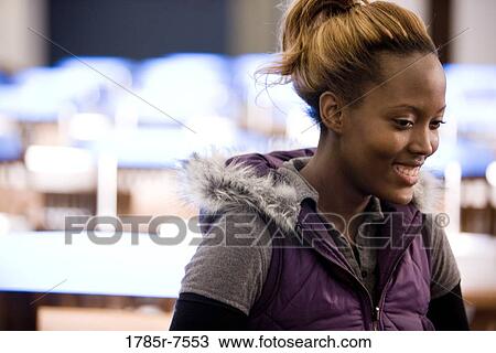 Close-up of a smiling young woman View Large Photo Image Stock Image - Close-up of a smiling young woman. Fotosearch