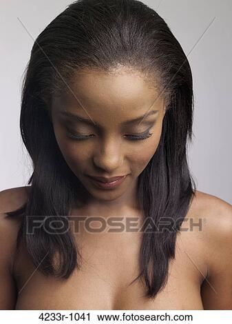 Stock Image - Close-up of a young woman eyes closed. Fotosearch