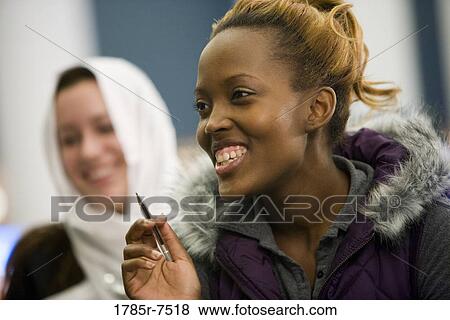 Stock Photo - Close-up of a young woman smiling. Fotosearch