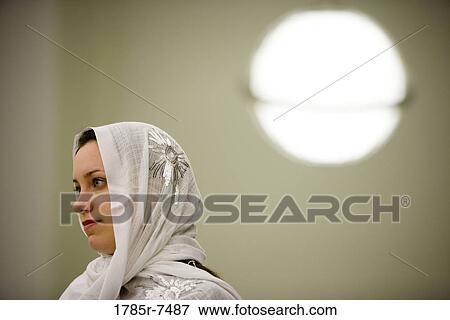 Stock Photo - Close-up of a young woman wearing a head scarf. Fotosearch