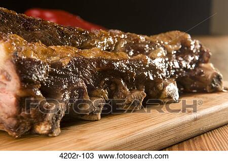 Close-up of asado on a cutting board View Large Photo Image Stock Image - Close-up of asado on a cutting board. Fotosearch