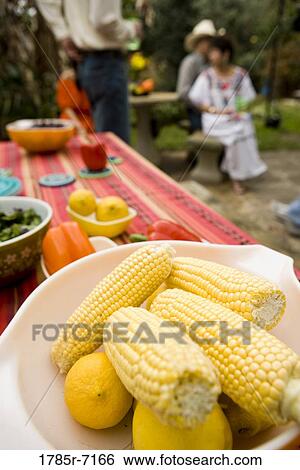 Close-up of bowl of corn and on a picnc table View Large Photo Image Stock Photograph - Close-up of bowl of corn and on a picnc table. Fotosearch
