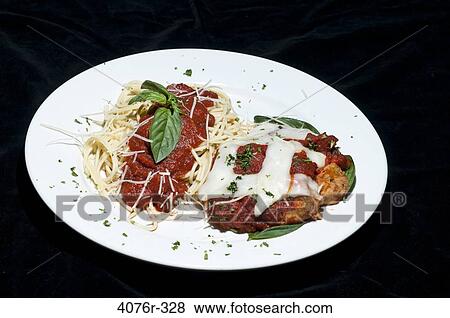 Close up of chicken meal with parmesan, noodles and basil View Large Photo Image Stock Photo - Close up of chicken meal with parmesan, noodles and basil. Fotosearch