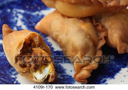 Close-up of empanadas on a plate View Large Photo Image Stock Image - Close-up of empanadas on a plate. Fotosearch